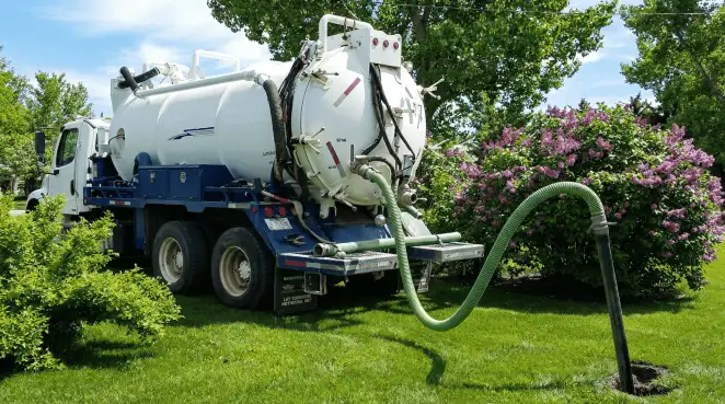 Professional vacuum truck performing residential drainage and septic maintenance in Chicago, IL