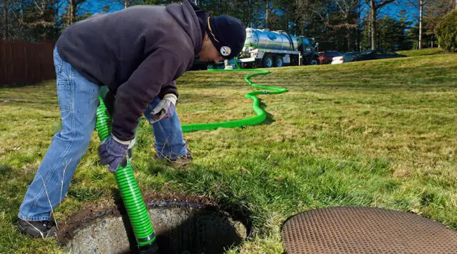 Service technician performing residential septic pumping and drainage maintenance in Chicago, IL